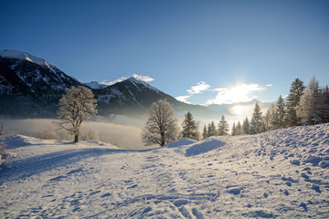 View to a winter landscape with mountain range of Gasteinertal valley near Bad Gastein, Pongau Alps...