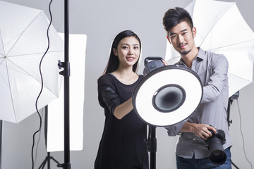 Portrait of two photographers in studio