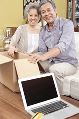 Senior couple receiving their online purchase