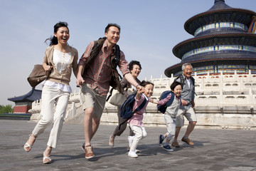 Happy family travelling at Temple of Heaven in Beijing, China