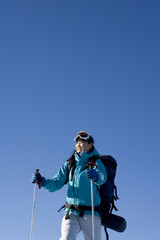 Young woman with ski equipment