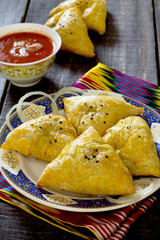 Traditional oriental food samosa, meat pies in a rustic style