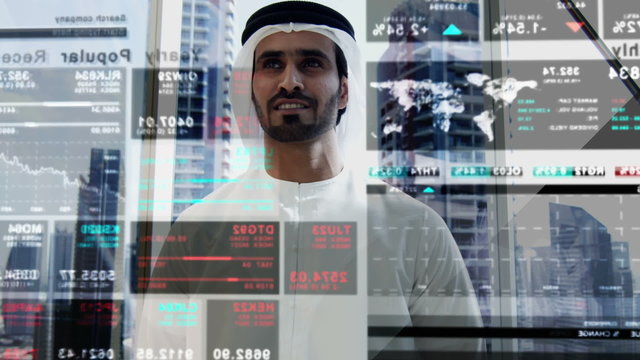 Middle Eastern business male technology motion graphics trade stocks touchscreen