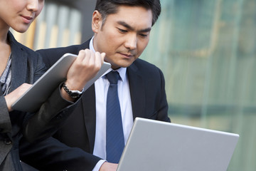 Business people using wireless technology