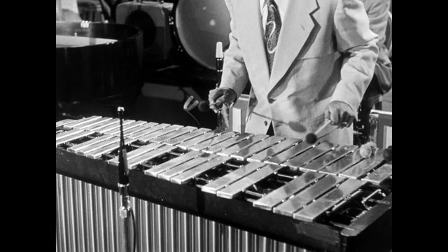 Medium shot of musician playing xylophone, 1950s