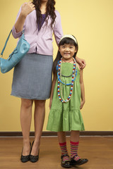 Mother And Daughter Posing For Camera