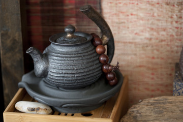 Chinese teapot and prayer beads