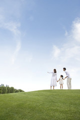 A young family enjoying the park
