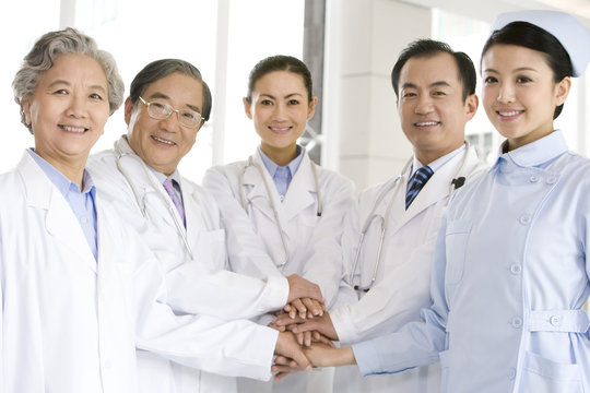 Doctors and Nurse Hands in a Huddle