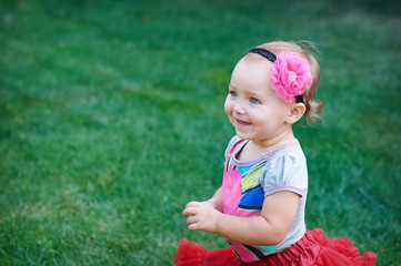 little happy cheerful girl running around playing and having fun
