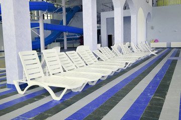 Many white empty chaise-longue