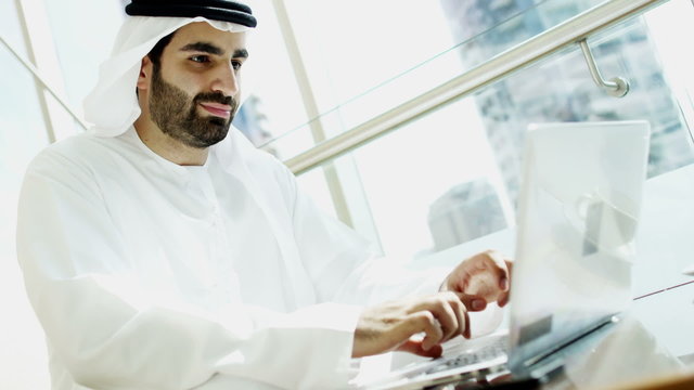 male Arabic construction real estate business laptop smart phone technology