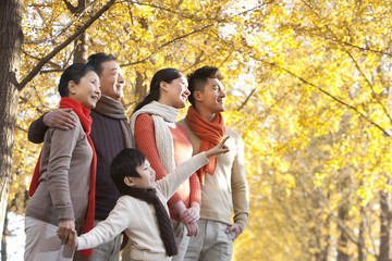 Family surrounded by Autumn trees