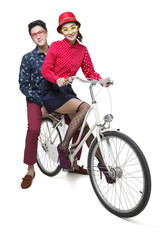 Young couple riding on a bike