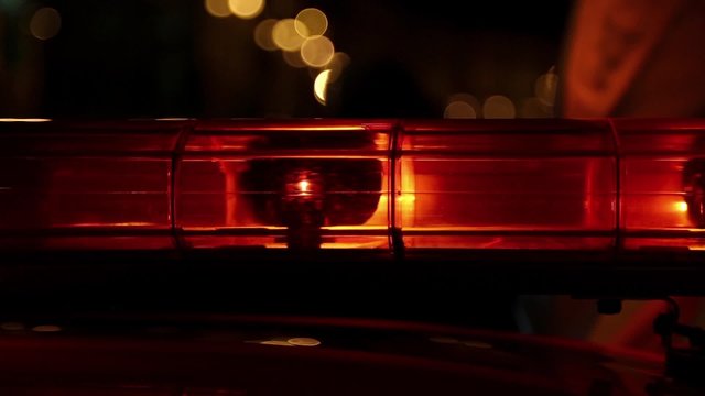 Lights flashing on the car at night. Flashing yellow signal lamps on the car