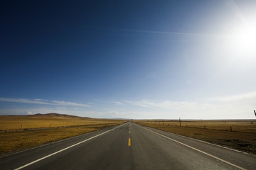 Highway leading through the wilds in Qinghai province, China