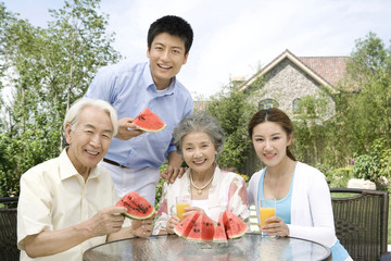 Family eating watermelon