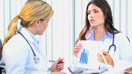 female blonde brunette Caucasian healthcare business financial results charts  - Powered by Adobe