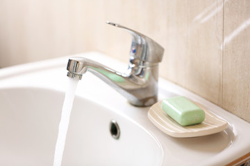 Washing of hands with soap under running water