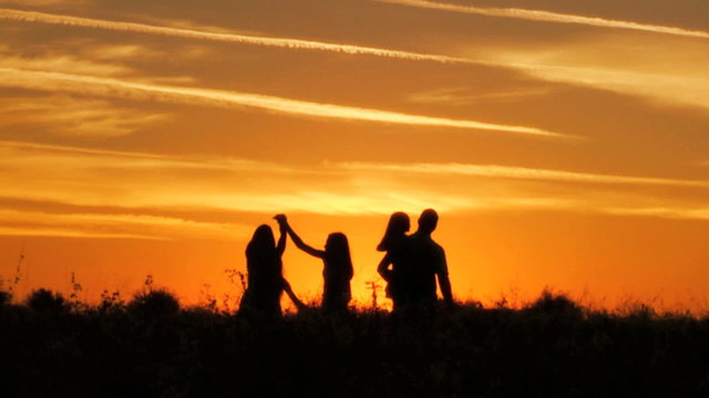 Heterosexual Parents Daughters Sunset Silhouette Outdoors Loving Casual Leisure