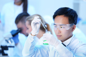 Young medical technicians working in laboratory