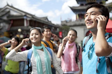 Young adults using cellphones