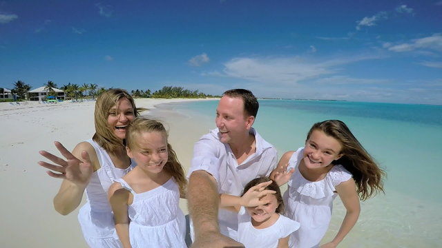 Social media portrait of happy Caucasian family on beach vacation 