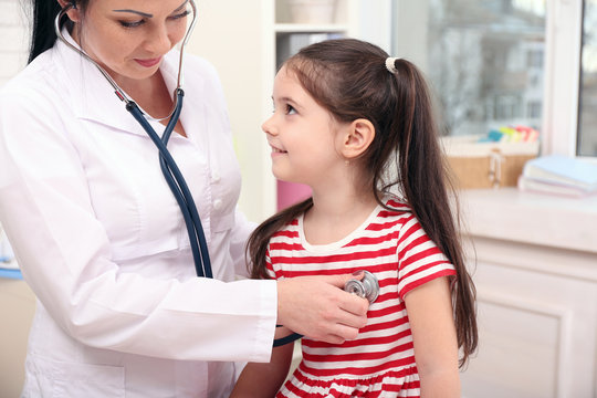 Doctor examining a child in the office