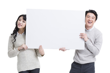 Young couple with whiteboard