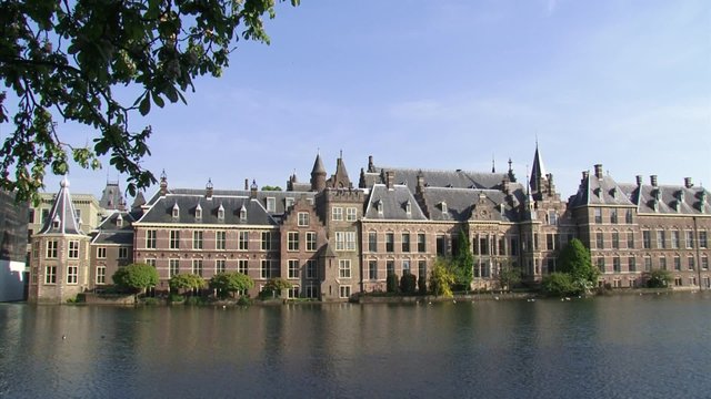 Binnenhof exterior + Hofvijver (pond). The Binnenhof, a complex of 13th century buildings, has been the centre of Dutch politics for many centuries. THE HAGUE, THE NETHERLANDS - 4 JUNE 2013
