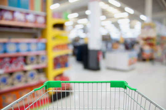 shopping cart in department store blurred with bokeh background