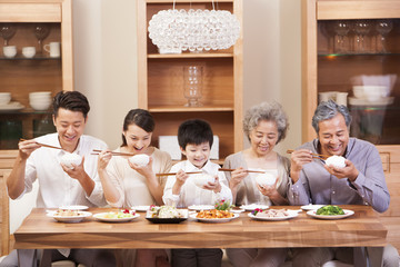Happy family enjoying meal time