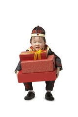 A young boy carrying presents for Chinese New Year