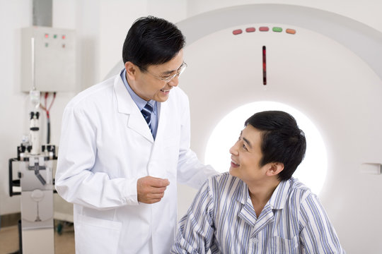  Medical professional and a patient in a MRI scanner