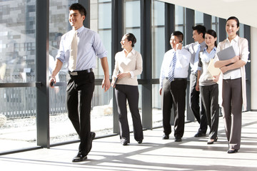 Businesspeople walking down a hallway