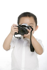 Little boy taking photo by digital camera