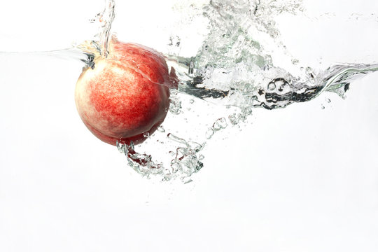 Peach Splashing In Water