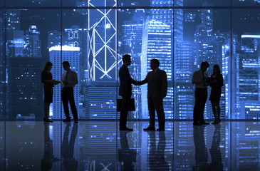 Business people handshaking in the city.