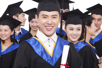 Portrait of graduates holding diploma 