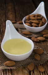 Bowl with almond oil (selective focus)