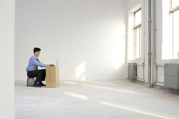 Businessman working in an empty office space