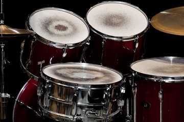 Detail of a drum kit in dark colors