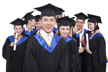 Portrait of graduates holding diploma 