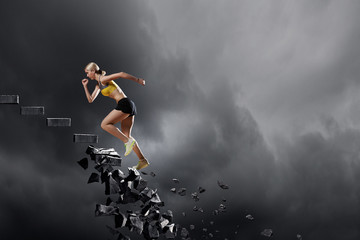Sports woman overcoming challenges - obrazy, fototapety, plakaty