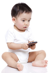 Adorable baby boy with smart phone