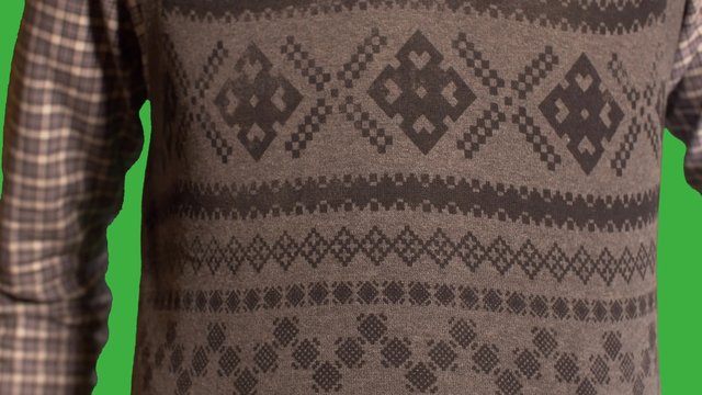 Man in Festive Christmas vest drinks from beer can- green screen background