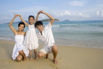 Portrait of young family at the beach