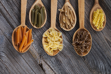 A set of raw pasta on a wooden table