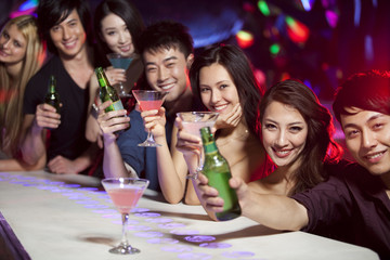 Stylish young people at bar counter