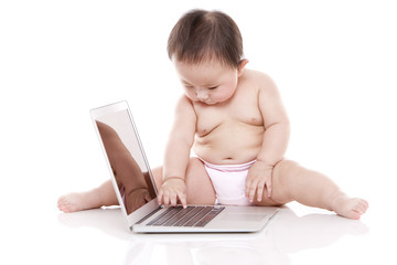 Cute baby girl with laptop